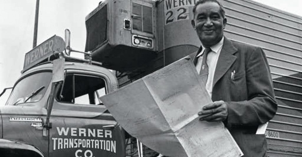 Frederick McKinley Jones standing next to a refrigerated van circa 1950