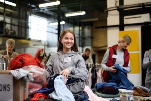 Volunteers sorting out donated clothes