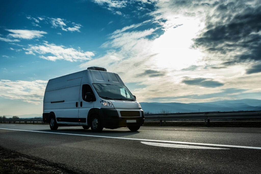 Cool Running Rental van driving at a steady speed