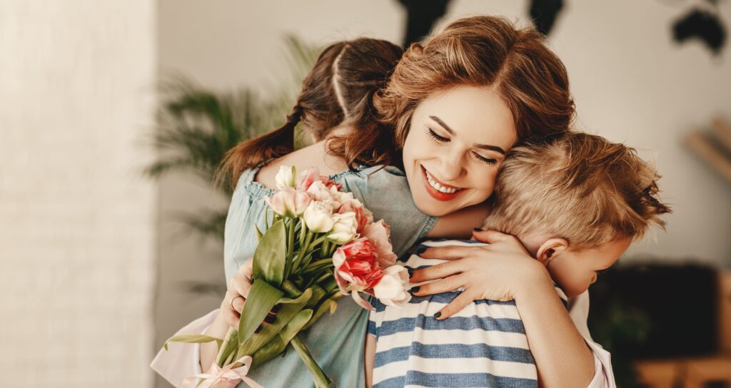 mother-receiving-flowers-from-children