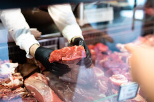 butcher-showing-meat